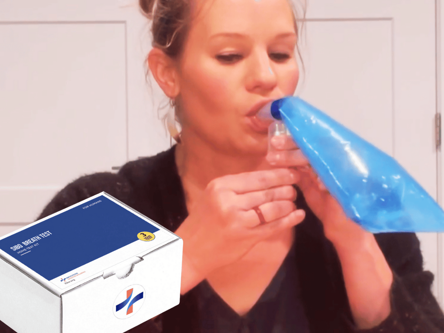 Woman using the At-Home SIBO Breath Test Kit