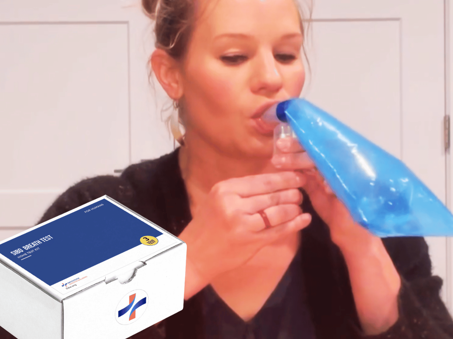 Woman using the At-Home SIBO Breath Test Kit